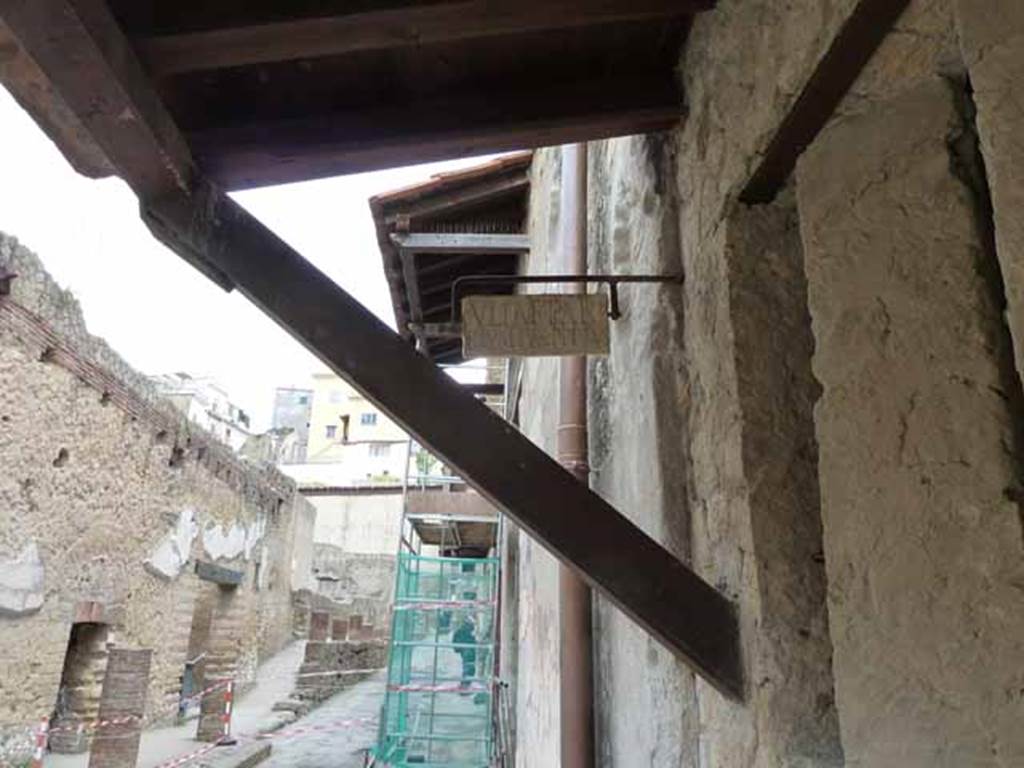 V. 4. May 2010. Looking north along east side of Ins. V from doorway of 4, showing plaque in position.